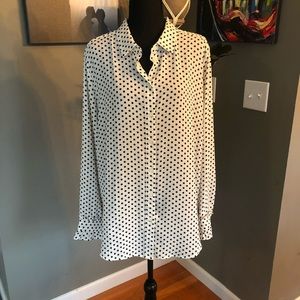 Black and white polka dot blouse with ruffled sleeves